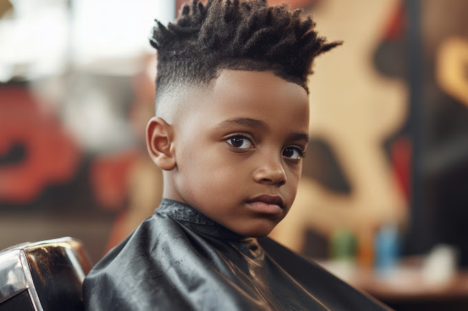 A young client in the barber chair with a fresh textured top and fade