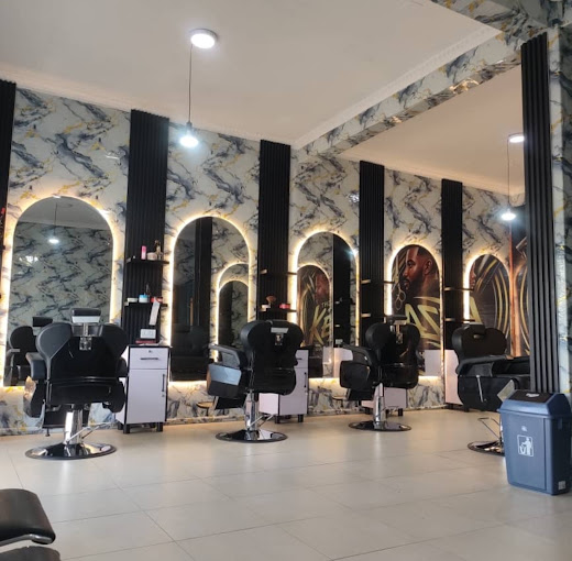 Inside The Keza Barber Shop: black barber chairs in front of arched, backlit mirrors